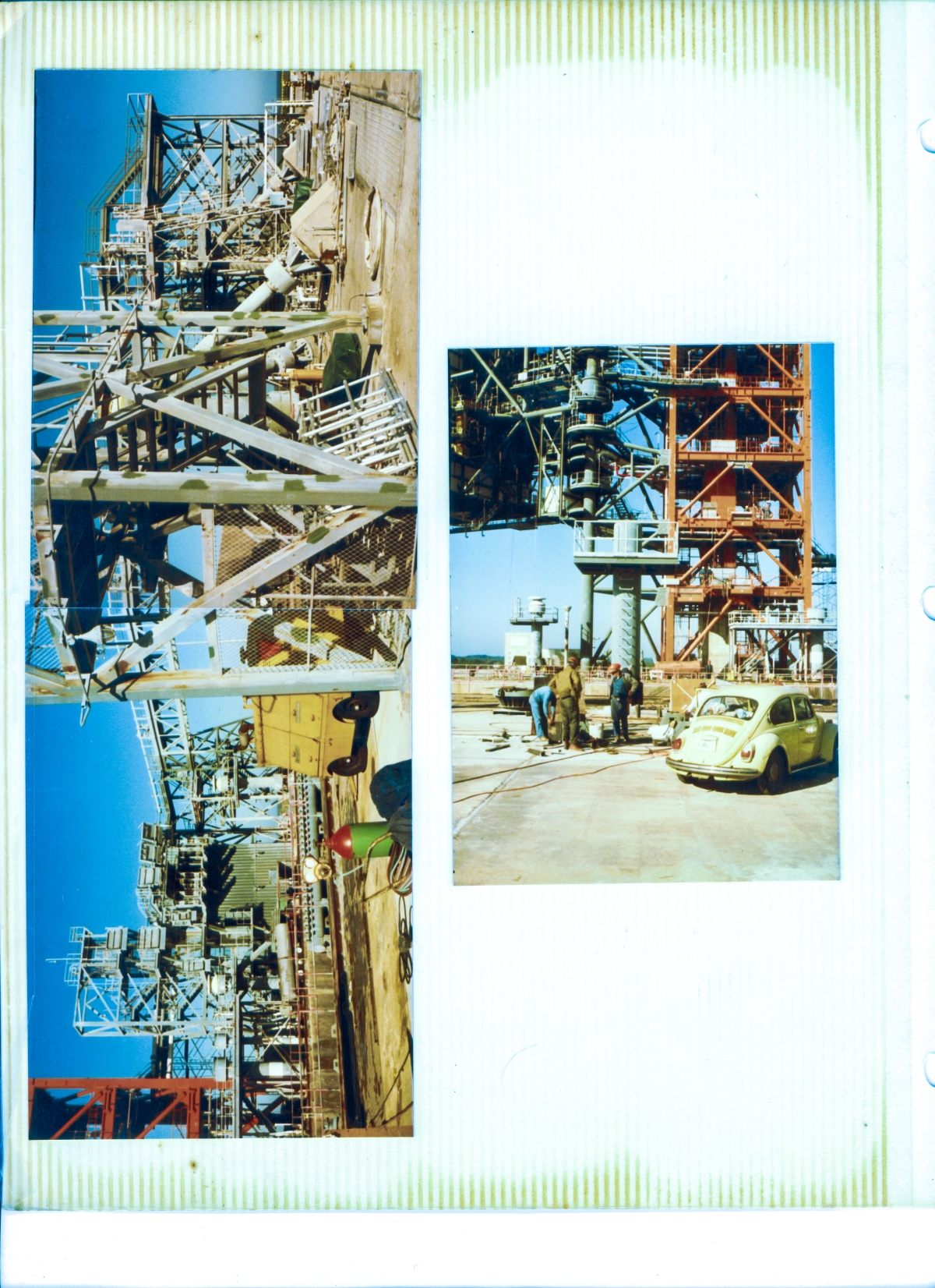 As viewed from the east side of the pad deck at Space Shuttle Launch Complex 39-B, Kennedy Space Center, Florida, across the Flame Trench from the Fixed Service Structure, you’re looking at Left: Everything north of the FSS on the entirety of the pad deck, and Right: The southeasternmost SSW Supply Pipe to the MLP and the lower portion of the Hinge Column and Struts area directly in line behind it, with part of the RSS to the left, and the lower portions of the FSS to the right, as Union Ironworkers from Local 808, working for Wilhoit Steel Erectors prepare for work on the RSS Hurricane Locks in front of the SSW Supply Pipe.